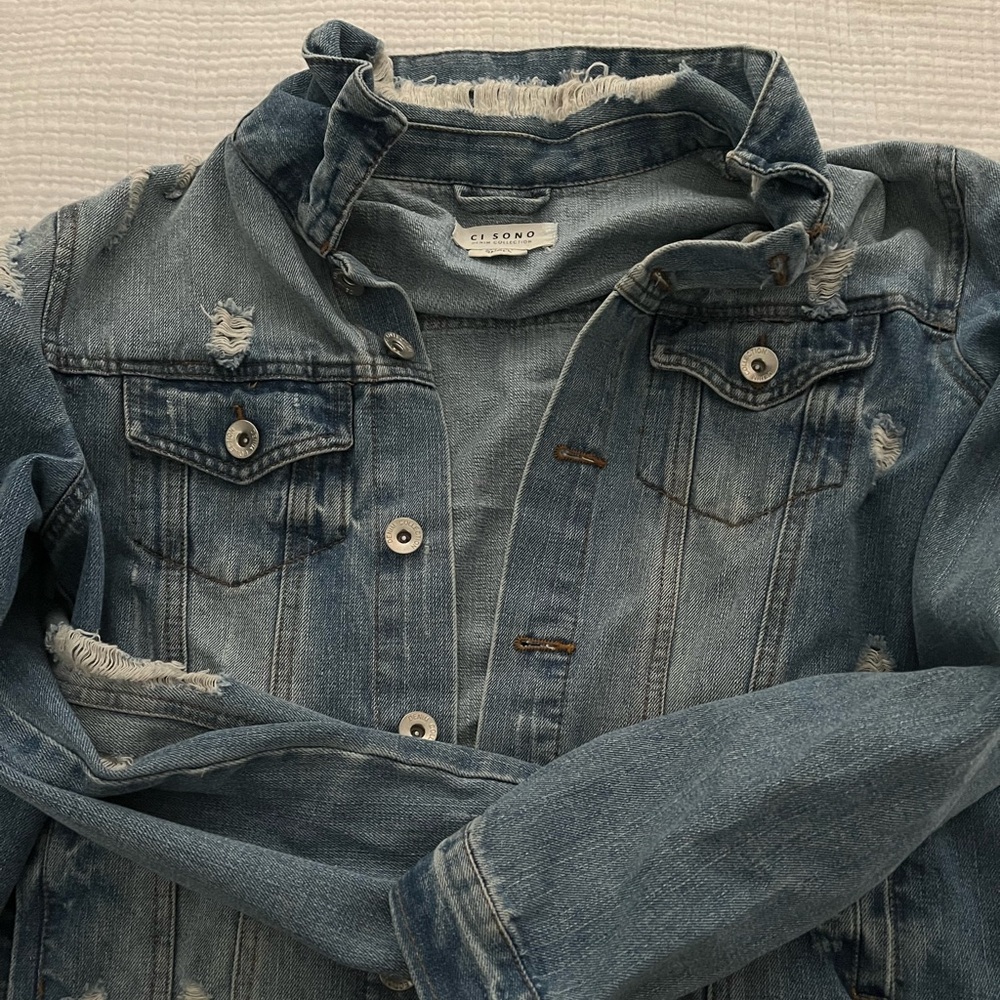 Distressed denim jacket
